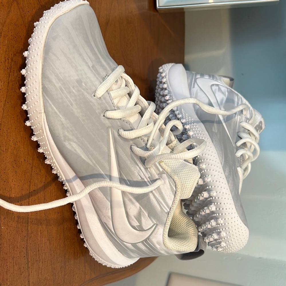 White/grey Nike girls lacrosse turf shoes